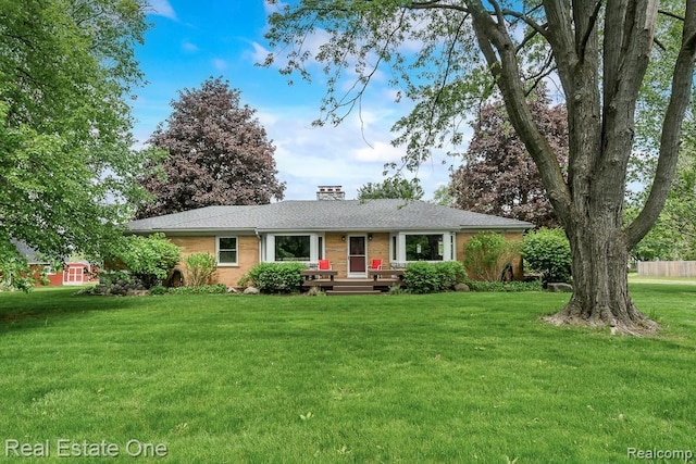 241 E Gunn Rd, Rochester, MI 48306 - ranch-style home featuring brick siding, a front yard, and a chimney