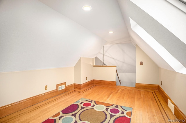 6140 Seymour Rd, Swartz Creek, MI 48473 - bonus room with a skylight, wood finished floors, lofted ceiling, recessed lighting, and baseboards
