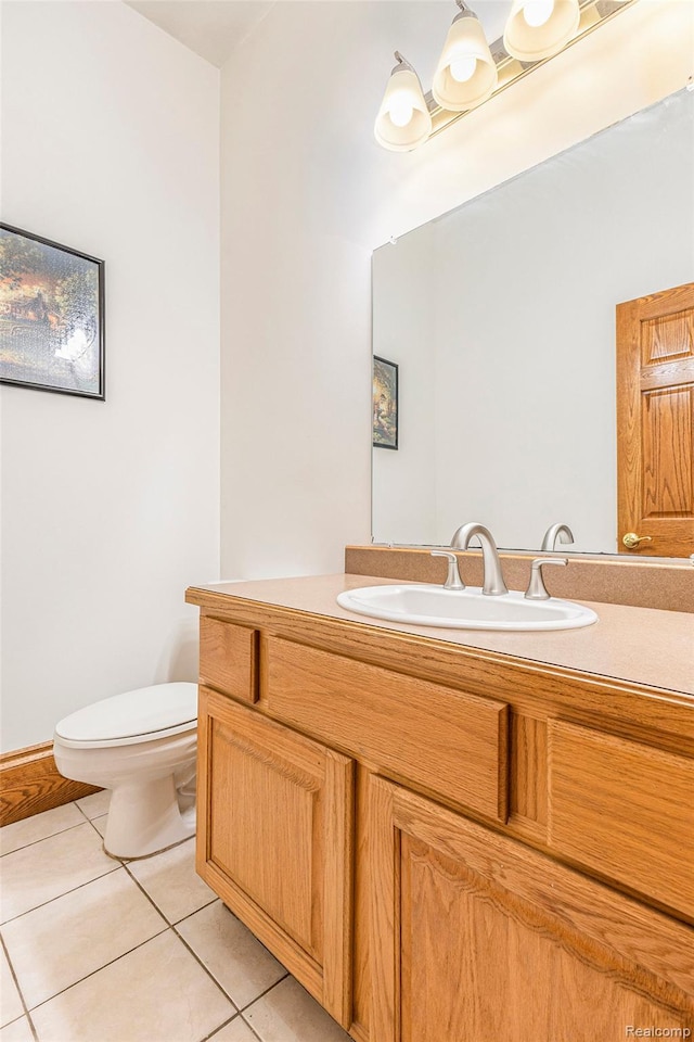 6140 Seymour Rd, Swartz Creek, MI 48473 - half bathroom featuring tile patterned flooring, vanity, and toilet