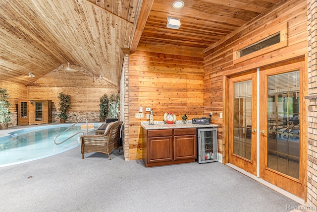 6140 Seymour Rd, Swartz Creek, MI 48473 - indoor bar with wood ceiling, wine cooler, wooden walls, lofted ceiling, and light carpet