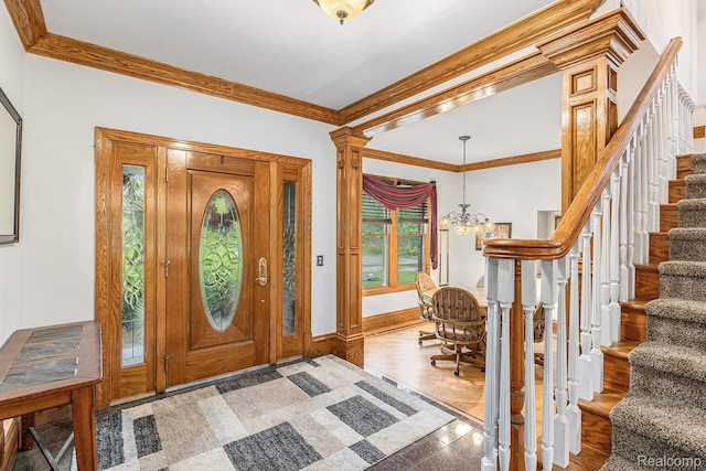 6140 Seymour Rd, Swartz Creek, MI 48473 - entryway with a chandelier, stairway, crown molding, baseboards, and granite tiled floors
