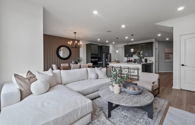 5555 E Spaniel Dr, Ann Arbor, MI 48108 - living area with a chandelier, recessed lighting, and light wood finished floors