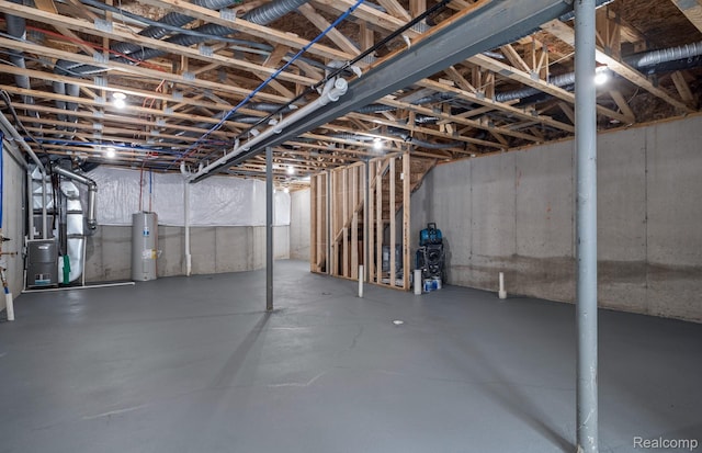 5555 E Spaniel Dr, Ann Arbor, MI 48108 - unfinished basement featuring water heater and heating unit