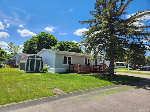 3683 Pinoak St, Clarkston, MI 48348 - manufactured / mobile home with a front lawn and a deck