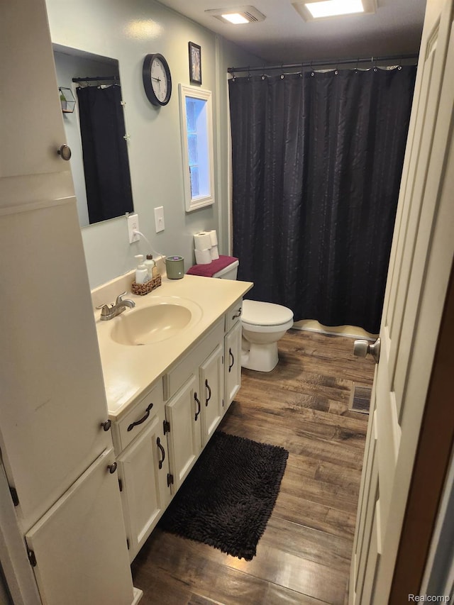 3683 Pinoak St, Clarkston, MI 48348 - bathroom featuring vanity, wood finished floors, toilet, and curtained shower