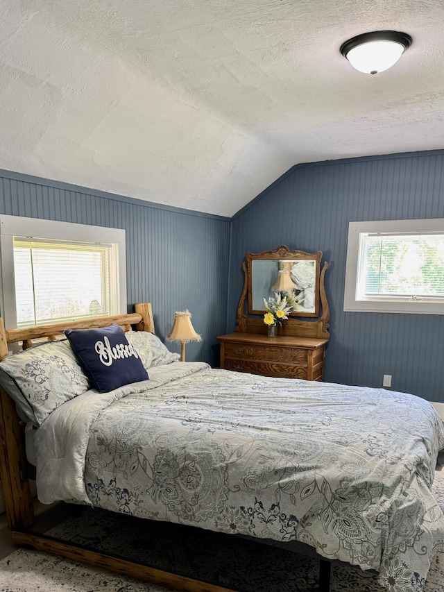 12227 Wise St, Bear Lake, MI 49614 - bedroom with lofted ceiling and a textured ceiling