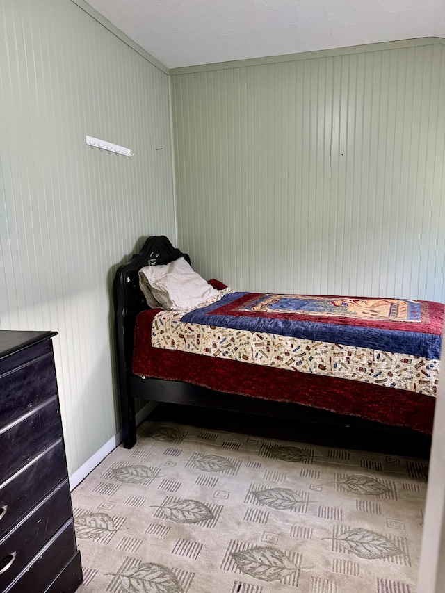 12227 Wise St, Bear Lake, MI 49614 - bedroom with wooden walls and baseboards