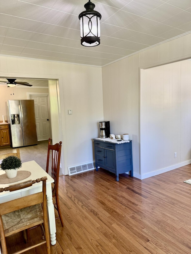 12227 Wise St, Bear Lake, MI 49614 - dining space featuring wood finished floors, baseboards, and a ceiling fan