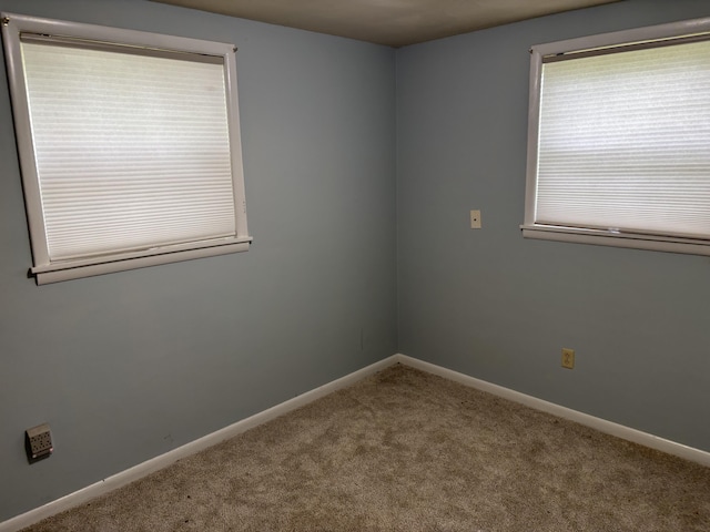 814 N Lakeview Ave, Sturgis, MI 49091 - carpeted spare room featuring baseboards