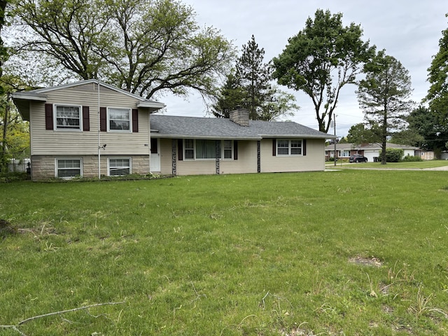 814 N Lakeview Ave, Sturgis, MI 49091 - split level home featuring a chimney and a front lawn
