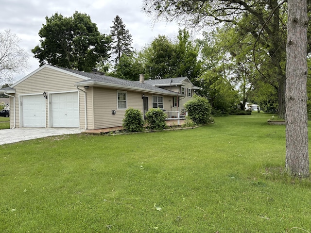 814 N Lakeview Ave, Sturgis, MI 49091 - view of front of home featuring a garage, a chimney, a front yard, and driveway