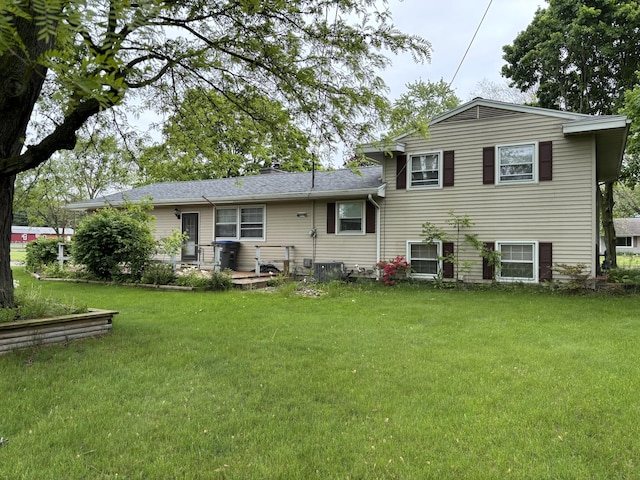 814 N Lakeview Ave, Sturgis, MI 49091 - back of house with a lawn and central air condition unit