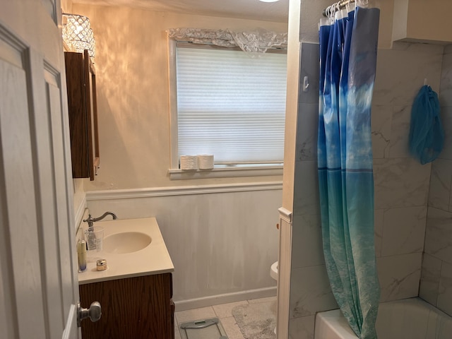 814 N Lakeview Ave, Sturgis, MI 49091 - bathroom featuring vanity, shower / tub combo with curtain, toilet, and tile patterned flooring