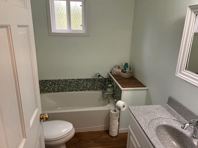 5260 Townhall Rd, Beaverton, MI 48612 - bathroom with a bath, toilet, vanity, and wood finished floors