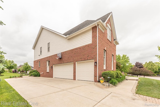 15390 Prestwick Cir, Northville, MI 48168 - view of side of home with brick siding, a garage, concrete driveway, roof with shingles, and a lawn