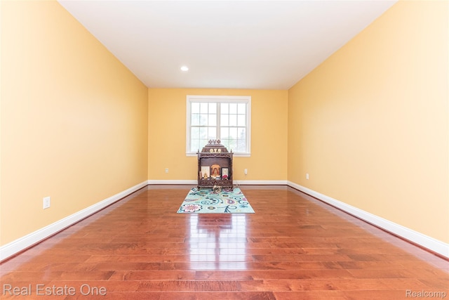 15390 Prestwick Cir, Northville, MI 48168 - unfurnished room featuring wood finished floors, baseboards, and recessed lighting
