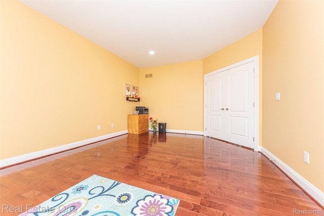 15390 Prestwick Cir, Northville, MI 48168 - unfurnished bedroom with wood finished floors, baseboards, and recessed lighting