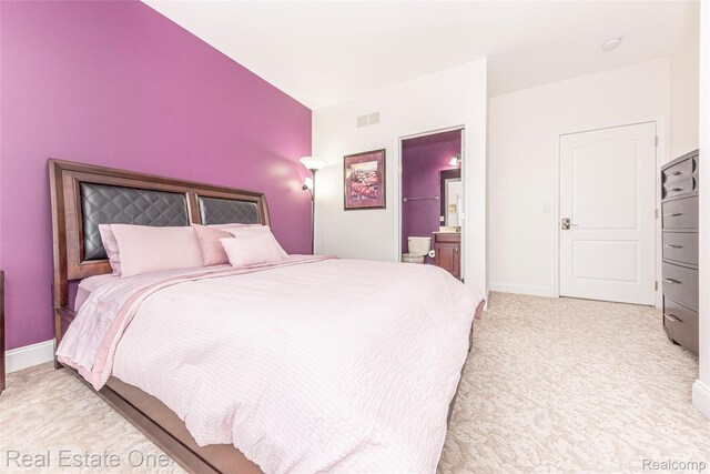 15390 Prestwick Cir, Northville, MI 48168 - bedroom featuring baseboards, light carpet, and ensuite bath