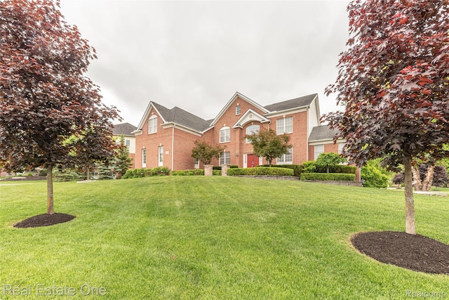 15390 Prestwick Cir, Northville, MI 48168 - view of front of house with brick siding and a front lawn