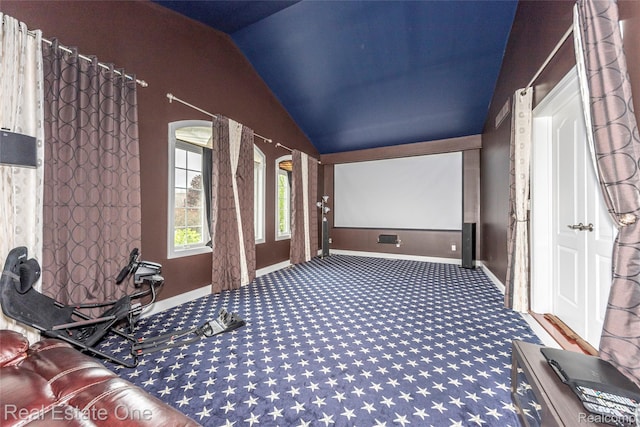 15390 Prestwick Cir, Northville, MI 48168 - cinema room featuring lofted ceiling, carpet floors, and baseboards