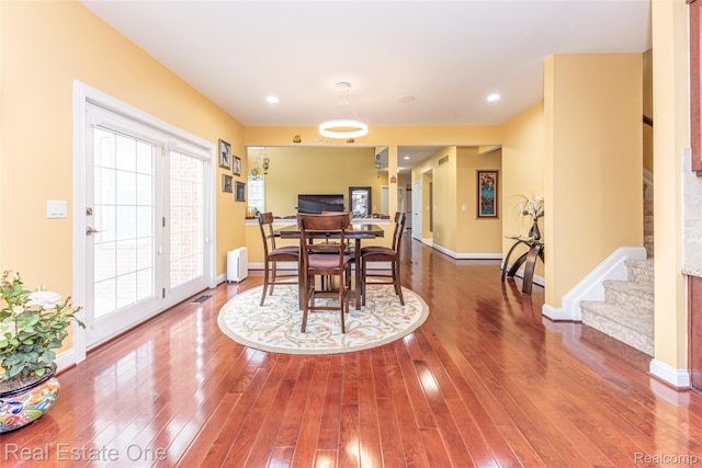 15390 Prestwick Cir, Northville, MI 48168 - dining area featuring wood-type flooring, stairway, baseboards, and recessed lighting