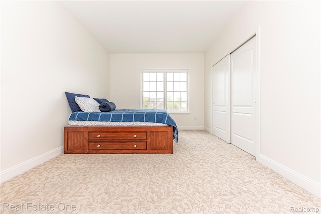 15390 Prestwick Cir, Northville, MI 48168 - bedroom with a closet, carpet floors, and baseboards