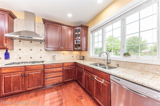 15390 Prestwick Cir, Northville, MI 48168 - kitchen featuring stainless steel dishwasher, a sink, wall chimney range hood, gas stovetop, and dark wood-style floors