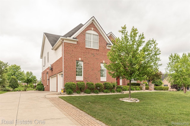 15390 Prestwick Cir, Northville, MI 48168 - traditional-style home with brick siding, concrete driveway, a front lawn, and a garage