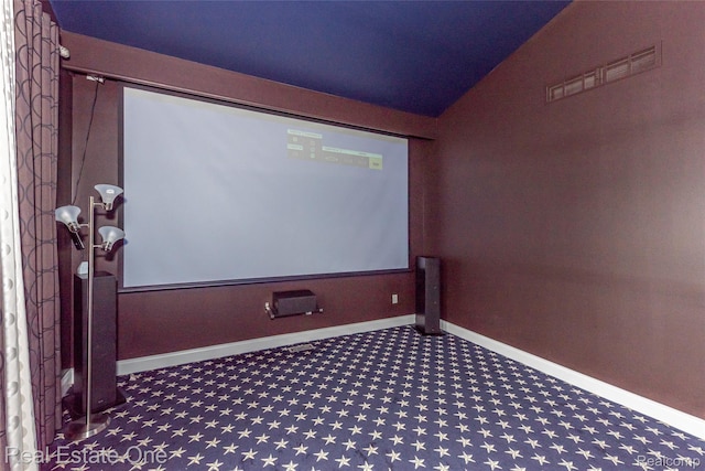 15390 Prestwick Cir, Northville, MI 48168 - carpeted cinema with vaulted ceiling and baseboards