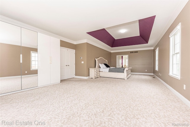 15390 Prestwick Cir, Northville, MI 48168 - unfurnished bedroom with light colored carpet, a tray ceiling, ornamental molding, and baseboards
