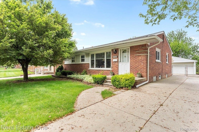 8424 Roosevelt St, Taylor, MI 48180 - view of front of home featuring brick siding, a front lawn, an outdoor structure, and a detached garage