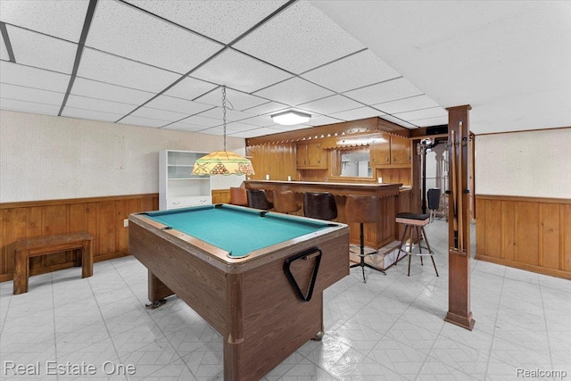 8424 Roosevelt St, Taylor, MI 48180 - playroom featuring wood walls, wainscoting, bar area, and a paneled ceiling