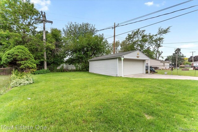 8424 Roosevelt St, Taylor, MI 48180 - view of yard featuring an outdoor structure and a garage