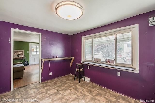725 E Sherman St, Holly, MI 48442 - office area featuring baseboards