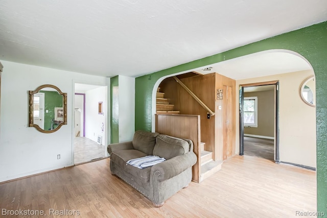 725 E Sherman St, Holly, MI 48442 - bedroom with wood finished floors, arched walkways, and baseboards