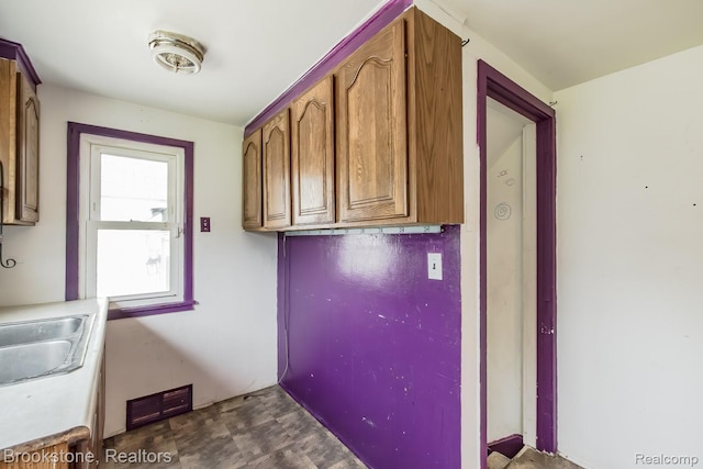 725 E Sherman St, Holly, MI 48442 - laundry area featuring a sink