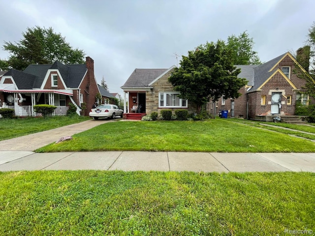 13960 Mettetal St, Detroit, MI 48227 - view of front of property featuring a front yard, stone siding, and concrete driveway