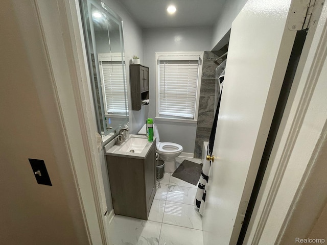 13960 Mettetal St, Detroit, MI 48227 - bathroom featuring vanity, toilet, marble finish flooring, baseboards, and recessed lighting