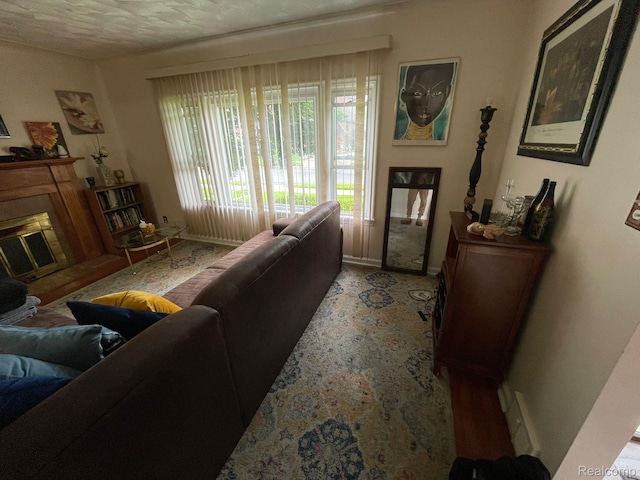 13960 Mettetal St, Detroit, MI 48227 - living room with a glass covered fireplace and baseboards