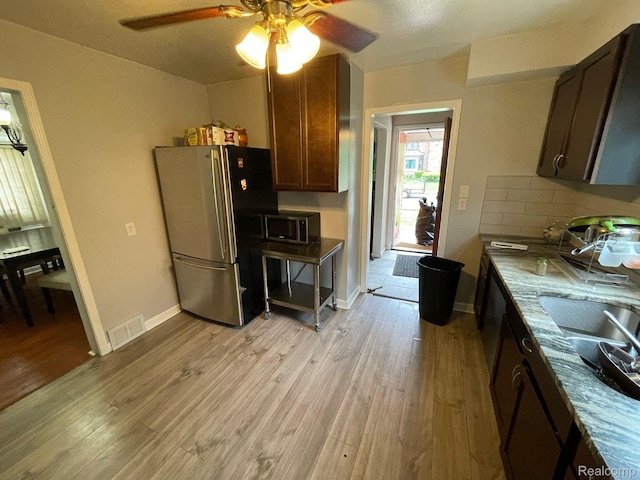 13960 Mettetal St, Detroit, MI 48227 - kitchen featuring stainless steel appliances, ceiling fan, and light wood finished floors