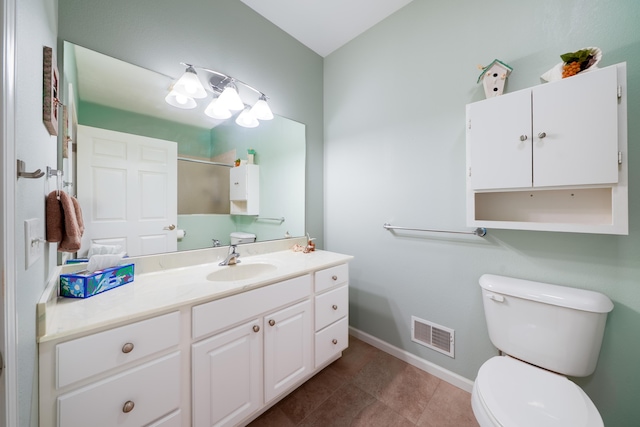 5610 Copper Sands Run, Fruitport, MI 49415 - bathroom featuring toilet, baseboards, vanity, tile patterned flooring, and a shower