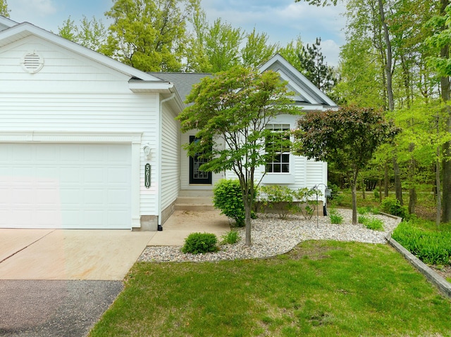 5610 Copper Sands Run, Fruitport, MI 49415 - view of front of home featuring an attached garage, driveway, and a front yard