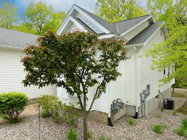 5610 Copper Sands Run, Fruitport, MI 49415 - view of side of home featuring a shingled roof and central AC unit