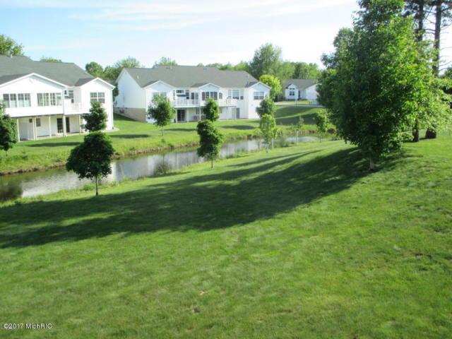 5610 Copper Sands Run, Fruitport, MI 49415 - view of grassy yard featuring a water view and a residential view