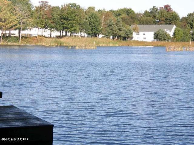 5610 Copper Sands Run, Fruitport, MI 49415 - water view with a dock