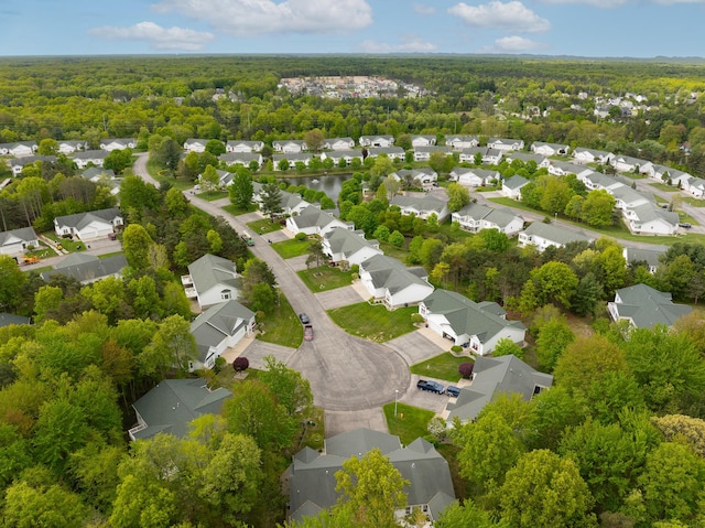 5610 Copper Sands Run, Fruitport, MI 49415 - aerial perspective of suburban area featuring a forest