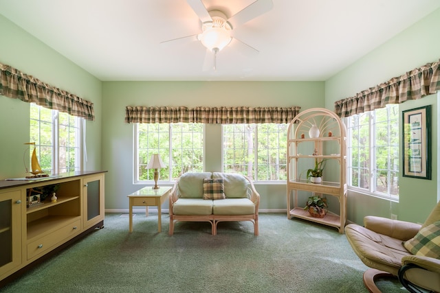 5610 Copper Sands Run, Fruitport, MI 49415 - sitting room with healthy amount of natural light, carpet flooring, ceiling fan, and baseboards