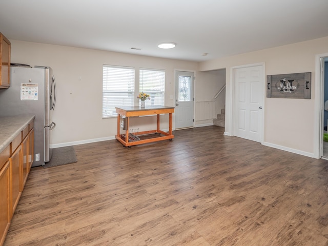 3247 Edling Dr, Kalamazoo, MI 49004 - living area with stairway, wood finished floors, and baseboards