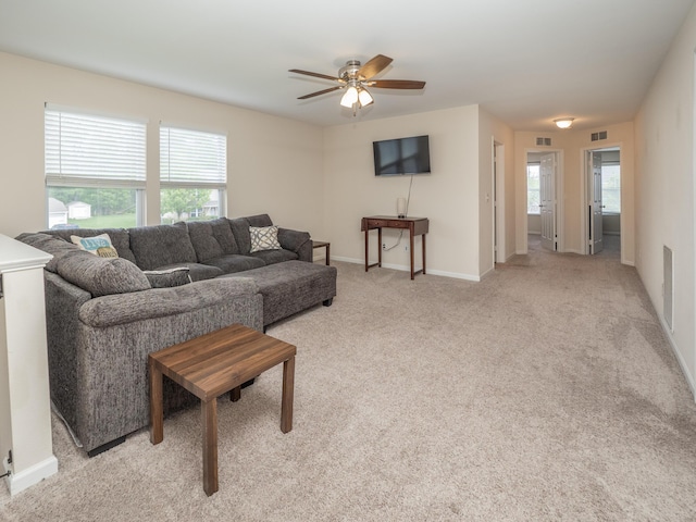 3247 Edling Dr, Kalamazoo, MI 49004 - living room featuring healthy amount of natural light, a ceiling fan, light carpet, and baseboards