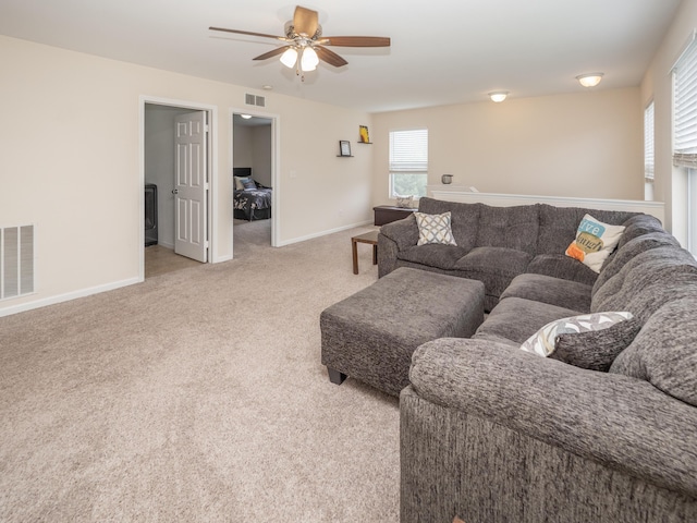 3247 Edling Dr, Kalamazoo, MI 49004 - living area featuring ceiling fan, light colored carpet, and baseboards